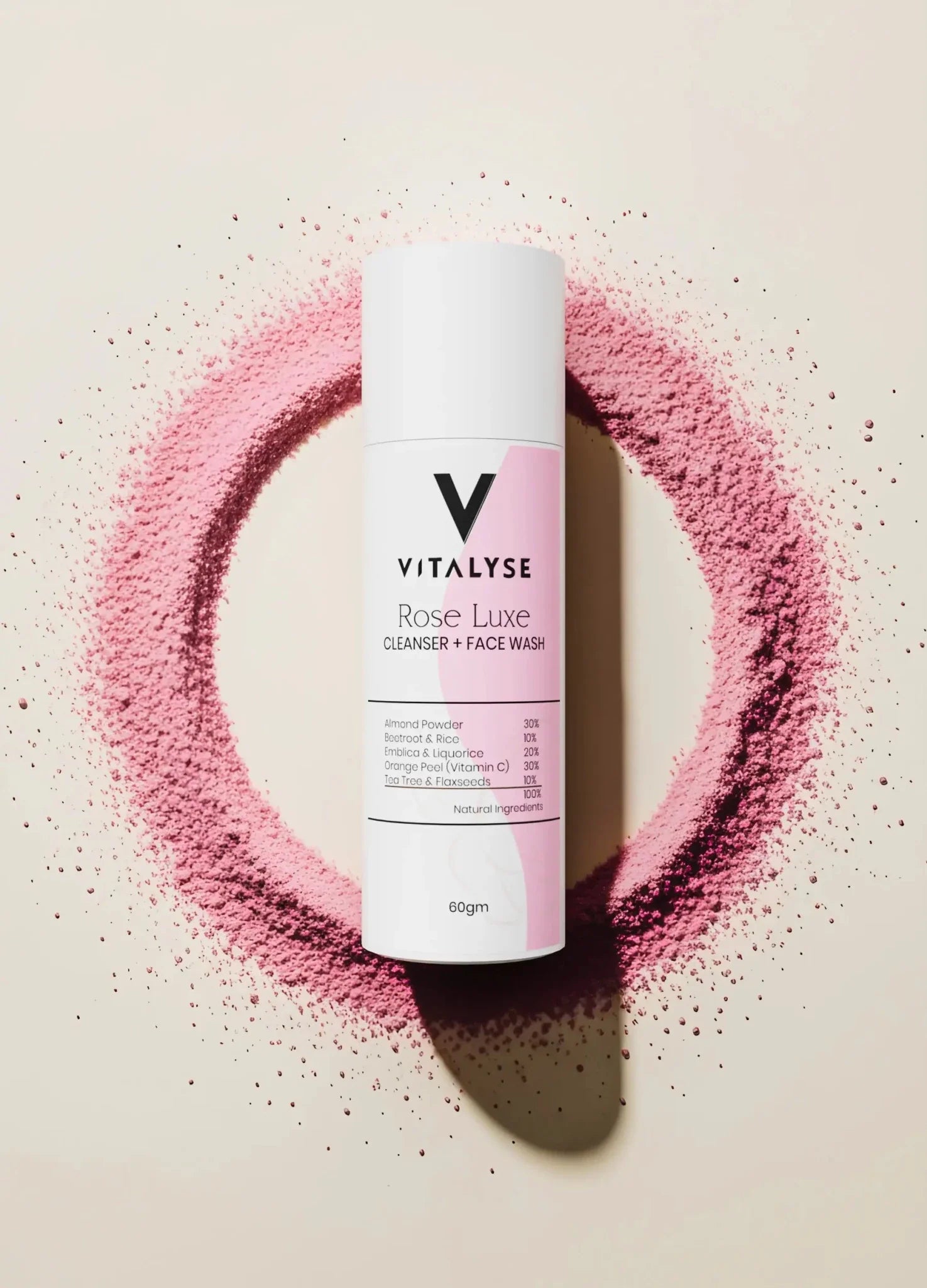 Rose Luxe cleanser and face wash bottle with natural ingredients, surrounded by pink powder